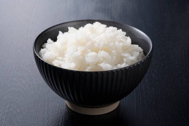 Rice on a black background, taken from an angle